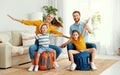 Happy parents and kids on suitcases in living room Royalty Free Stock Photo