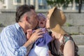 Happy parents kissing their baby Royalty Free Stock Photo