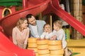 happy parents looking at adorable little kids playing together Royalty Free Stock Photo