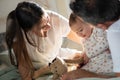 Happy parents playing with baby child in bedroom Royalty Free Stock Photo