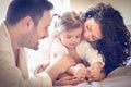 Happy parents with their little girl. Portrait.