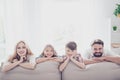 Happy parents and thier cheerful kids - blond small girl, brunet Royalty Free Stock Photo