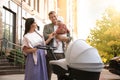 Happy parents walking with their baby outdoors Royalty Free Stock Photo