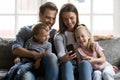 Happy parents and kids making video phone call from home Royalty Free Stock Photo