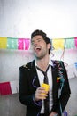 Happy party young man drinking enjoying alone Royalty Free Stock Photo