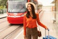 Happy Passenger Woman With Suticase Standing Near Arriving Tram Outdoor Royalty Free Stock Photo