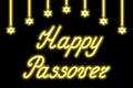 Happy Passover. Gold neon lettering. Garland of shining stars of David. Black background Royalty Free Stock Photo