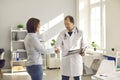 Happy patient shaking hands with mature doctor thanking him for professional help Royalty Free Stock Photo