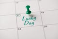 Happy Patrick`s day concept. Cropped close up view photo image of pushpin attached to calendar with text written green letters