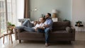 Happy peaceful married couple relaxing at home, resting on couch Royalty Free Stock Photo
