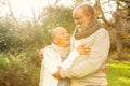 Happy peaceful senior couple embracing