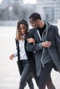 Happy pedestrian couple. Joyful African American