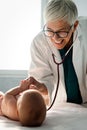 Pediatric doctor exams little baby. Health care, medical examination, people concept Royalty Free Stock Photo