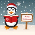 Happy Penguin & Merry Christmas Sign Royalty Free Stock Photo