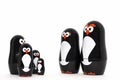 Happy penguin toy parent figure with adorable kids.