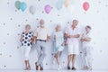 Happy pensioners holding balloons