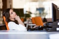 Happy pensive businesswoman planning and looking sideways at office Royalty Free Stock Photo