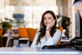 Happy pensive businesswoman planning and looking sideways at office Royalty Free Stock Photo