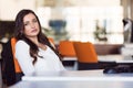 Happy pensive businesswoman planning and looking sideways at office Royalty Free Stock Photo