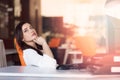 Happy pensive businesswoman planning and looking sideways at office Royalty Free Stock Photo