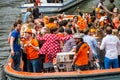 Happy people on boat at Koninginnedag 2013