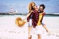 Happy people couple enjoy relationship and summer holiday vacation together laughing and having fun - man carry woman and enjoy Royalty Free Stock Photo