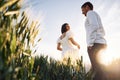 Happy people. Couple just married. Together on the majestic agricultural field at sunny day Royalty Free Stock Photo
