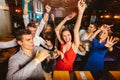 Happy people are dancing in club. Nightlife and disco concept Royalty Free Stock Photo