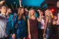 Happy people are dancing in club. Nightlife and disco concept Royalty Free Stock Photo