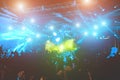 Happy people dancing and having fun in summer music festival party outdoor - Crowd celebrating concert event - Soft focus on Royalty Free Stock Photo