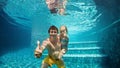 Happy family dive underwater with fun in swimming pool Royalty Free Stock Photo