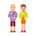 Happy people drinking coffee and eat cookies. Young man and woman standing and holding coffee cups and pastry. Couple having Royalty Free Stock Photo