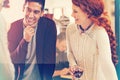 Happy people, drinking and laughing with team for funny joke, humor or discussion at office. Young man and woman with Royalty Free Stock Photo