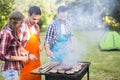 Happy people having camping and having bbq party Royalty Free Stock Photo