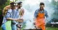 Happy people having camping and having bbq party Royalty Free Stock Photo