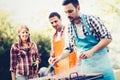 Happy people having camping and having bbq party Royalty Free Stock Photo