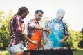 Happy people having camping and having bbq party Royalty Free Stock Photo