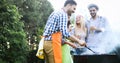 Happy people having camping and having bbq party Royalty Free Stock Photo