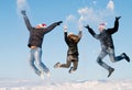 Happy people jumping in winter