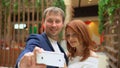 Happy people make selfies. Lovely woman enjoying shopping at the mall with her boyfriend Royalty Free Stock Photo