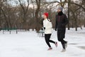 Happy people running in winter park. Outdoors sports exercises Royalty Free Stock Photo