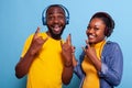 Happy people showing rock symbol with fingers on camera Royalty Free Stock Photo