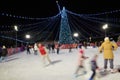 Happy people skating on a skating ring on Christmas eve, Russia, Istra