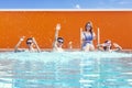 Happy people splashing water on swimming pool Royalty Free Stock Photo