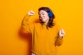 Happy person dancing and listening to music on headphones