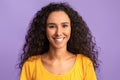 Happy Person. Portrait of smiling woman with tanned skin and curly hair