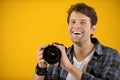 Happy photographer with SLR camera Royalty Free Stock Photo