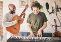 Happy, piano and friends with guitar recording music in home studio together. Electric keyboard, acoustic instrument or Royalty Free Stock Photo