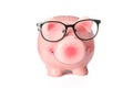 Happy piggy bank with glasses isolated on white background