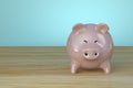 Happy Piggy bank on table